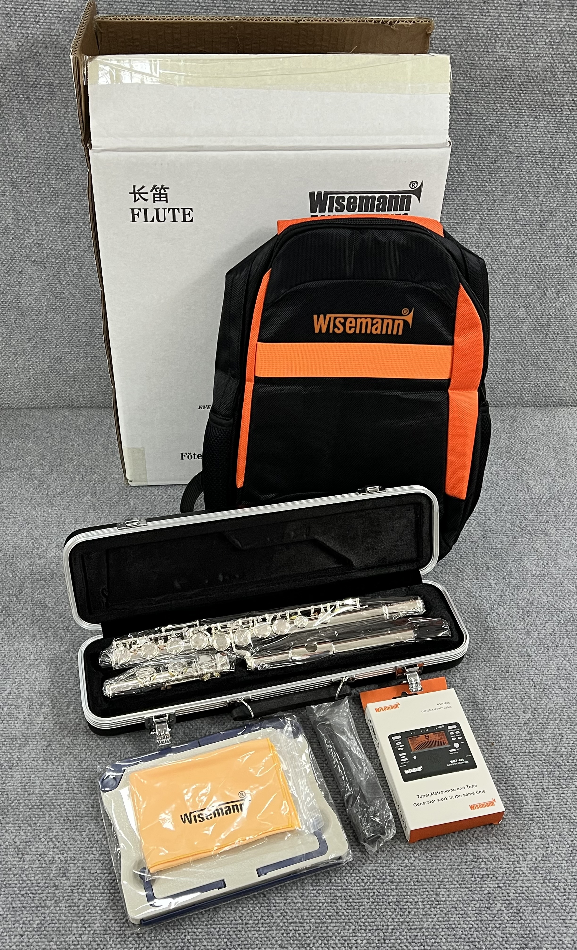 WI-0901FL WISEMANN TAURUS FLUTE KIT, SILVER PLATED FINISH, 16 HOLES, INCLUDES WISEMANN ABS FLUTE CASE, BACKPACK BAG, DIGITAL TUNER, TABLE MUSIC STAND, FLUTE STAND, CARE KIT.